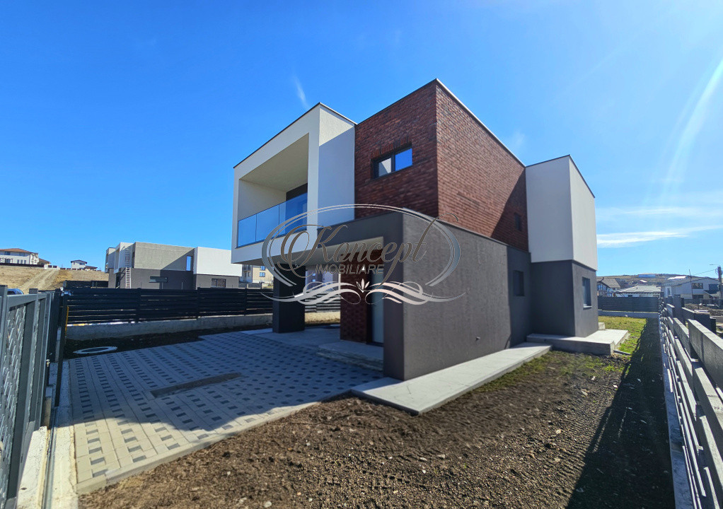 Locuinta moderna cu design cubic si curte plana in Dezmir